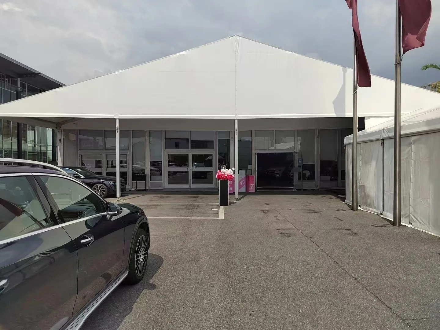 Auto show tent interior with display vehicles